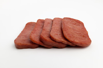Baked canned ham on white background