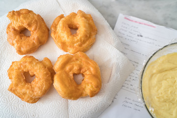 The Neapolitan pastry is called zeppola di san giuseppe, with black cherries, lemon cream with vanilla - Street Food Naples - Italy