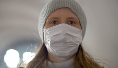 Woman on the subway escalator