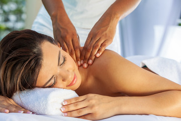 Fototapeta na wymiar Woman At Health Spa Having Relaxing Massage