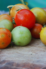 small fresh cherry tomatoes with green vines