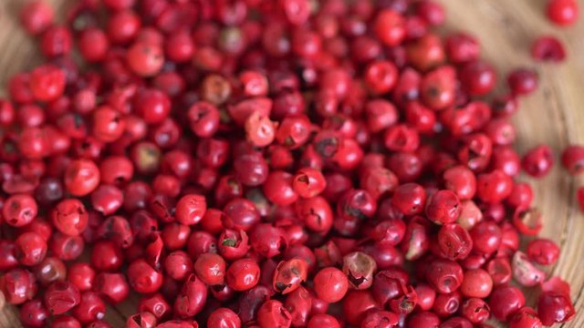 Food spices pink peppercorns red pepper Himalayan pepper berries. concept of fresh and dietary spices for cooking schools vegans and dietary products