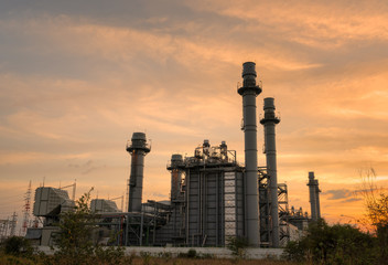 Fototapeta na wymiar Gas turbine electrical power plant in industrial Estate. Power plant at sunset..