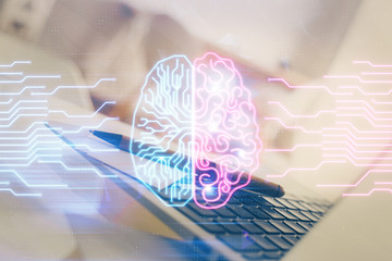 Double exposure of work space with computer and human brain drawing hologram. Brainstorm concept.