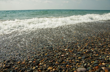 Sea waves running onto a pebble beach
