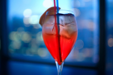 cocktail in a modern restaurant / glass with a bright cocktail in the fashionable interior serving in the restaurant, nightclub