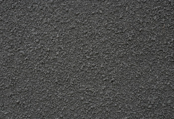 Fototapeta na wymiar background and texture of black sand spray on decorative wall