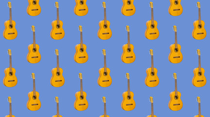 Pattern seamless acoustic guitar on blue background.