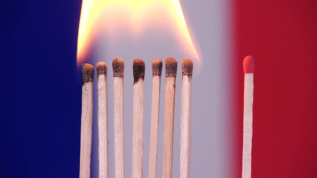 Coronavirus outbreak, social distancing in France. Concept: spreading epidemic, domino effect, COVID-19,  isolated burning matches, stop spreading virus