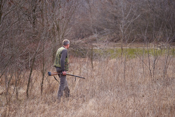 Hunter shooting ducks