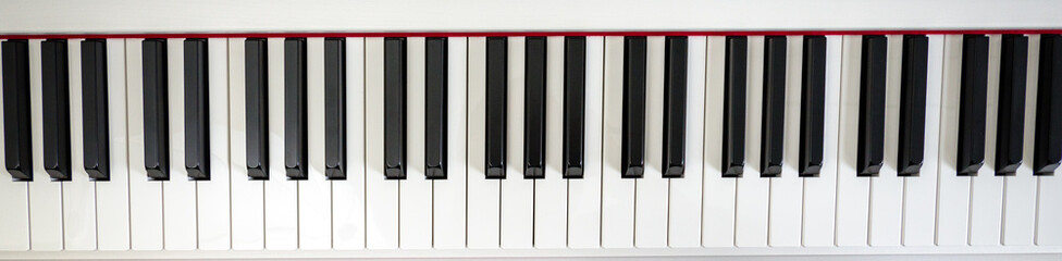 close-up of piano keys. close frontal view, black and white piano keys, viewed from above, top view