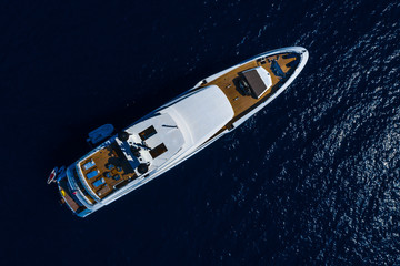 Aerial drone top down photo of Luxury Yacht boat near the famous island of Capri, Italy.