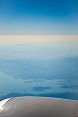 View of the Mediterranean from the porthole of an airplane