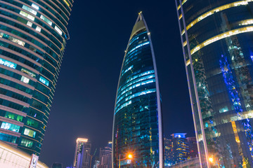 Night urban skyline of modern skyscrapers in Financial District in Doha, Qatar