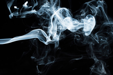 Photo of a wisp of smoke on a dark background