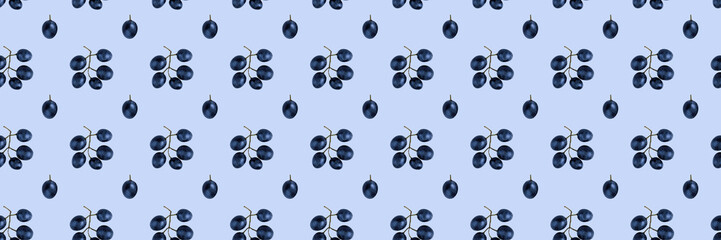 Seamless pattern of grapes isolated on blue. Food background. Flat lay
