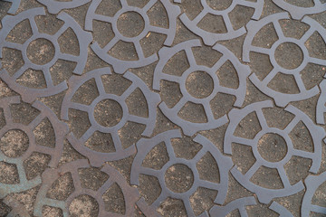 Background image of a road made of metal gears