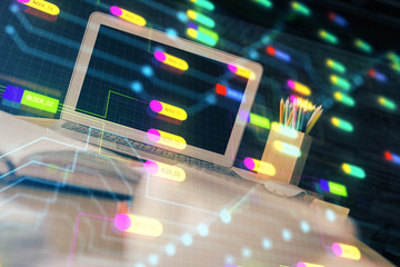 Double exposure of desktop computer and technology theme hologram. Concept of software development.