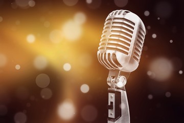 Retro style microphone on bokeh background