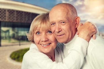 Outdoor portrait of a happy loving senior couple