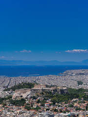 Fototapeta na wymiar Athens Greece, panoramic view of the urban texture with Parthenon and other ancient temples on Acropolis hill