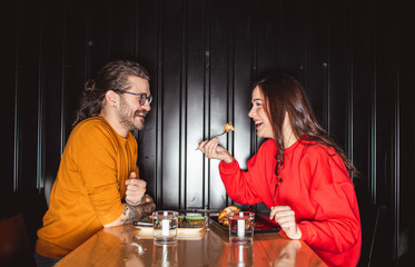 	 Young couple enjoying in fast food restaurant	