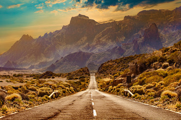 Image related to unexplored road journeys and adventures.Road through the scenic landscape to the destination in Tenerife natural park. - obrazy, fototapety, plakaty