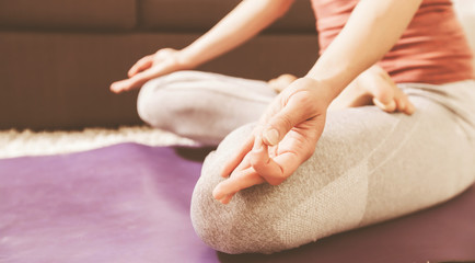 Obraz na płótnie Canvas Woman Practicing Yoga and Meditation