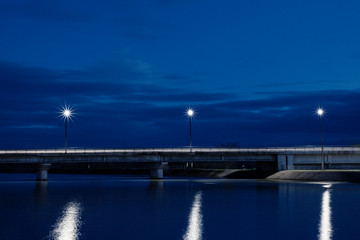 Naklejka na ściany i meble Bridge at Night / Dark Blue Midnight Photo Of City Dam
