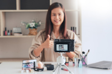 Obraz na płótnie Canvas Makeup Beauty fashion blogger recording video presenting cosmetics at home influencer on social media concept.