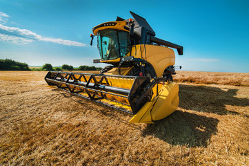 A close look of a modern combine harvester, wide angle