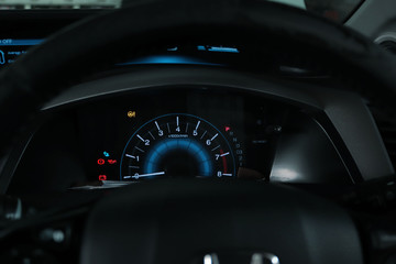 The mechanic is checking the engine.