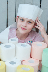 The girl wrapped her head in white toilet paper, like a medical bandage. In front of her on the...