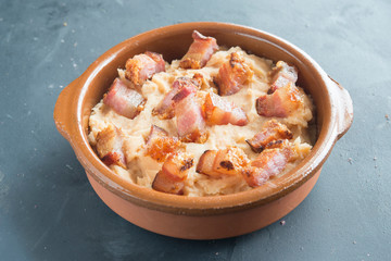 mashed potatoes with slice of bacon