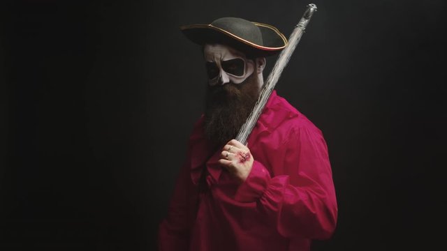 Scary bearded man dressed up like a pirate