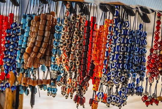 Various multi-colored worry beads hanging for sale in Athens.