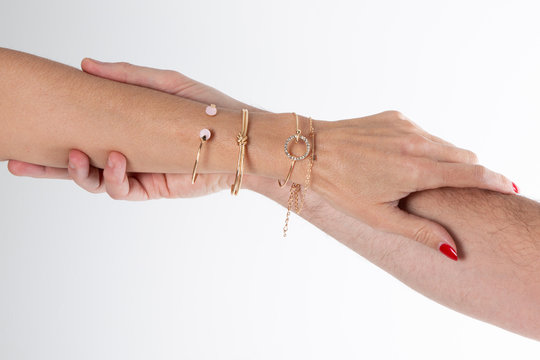 Two Women Hands Gripping One Another Man Arm Hanging On With Jewelry