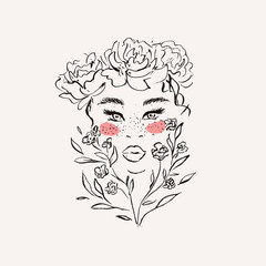 Woman with freckles and flowers in her hair