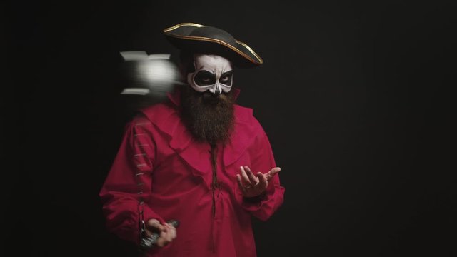 Bearded man with makeup and pirate costume