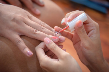 Nail beautician for customers before the wedding