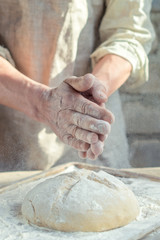 Baker man hands under wheat rustic style