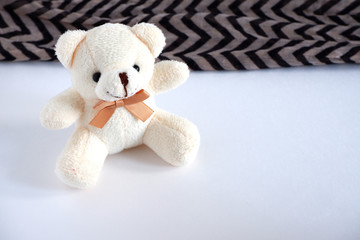 Fototapeta premium A soft beige bear is sitting there. Children's toy