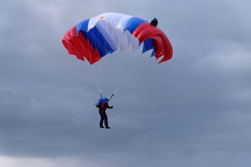 A parachute is flying in the sky.