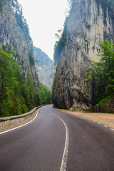 Bicaz Gorge road in Romania, is one of the most spectacular drives in the country, location in Carpathian mountain. The high cliffs of the gorge are divided by the mountain river Bicaz.