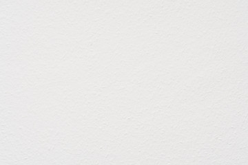 Ingrain wood chip wall paper painted white textured background