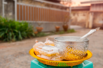 Bowl of rice, food, sweets on a golden tray. Prepare to put food on monks in morning time.