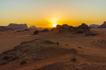 Fototapeta na wymiar Vintage photos from archive. Jordan. Sunset in Wadi Rum desert. Martian landscapes in lifeless desert. Red rocks and red sand.