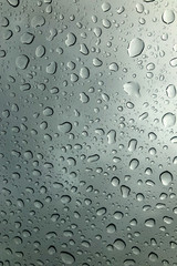 Water drop on the clear glass. fogged misted window with rain drops. Abstract background.