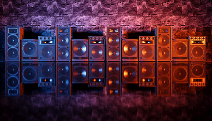 speaker system on a black background in blue and orange lighting