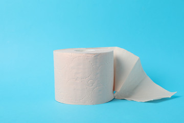 Toilet paper on blue background, space for text